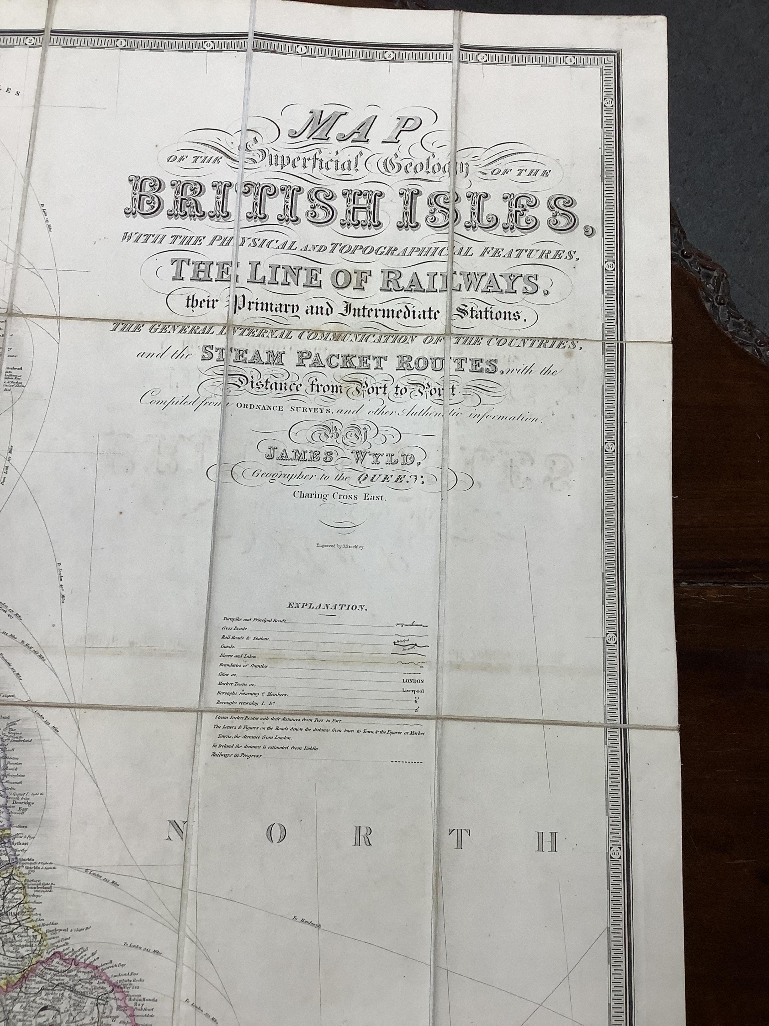 James Wyld, a mid-19th century cloth mounted map of the British Isles, including the line of railways, their primary and intermediate stations, etc. engraved by S. Stockley, in a slip case. Condition - poor to fair.